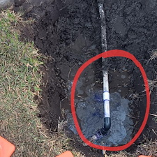 Broken-water-service-pipe-at-the-side-of-the-house-and-underground 0